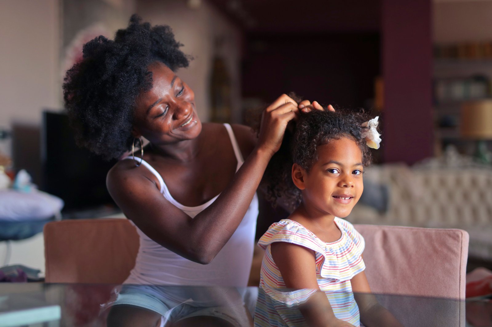 Black teenage girl expressing confidence with her natural hair and complexion.